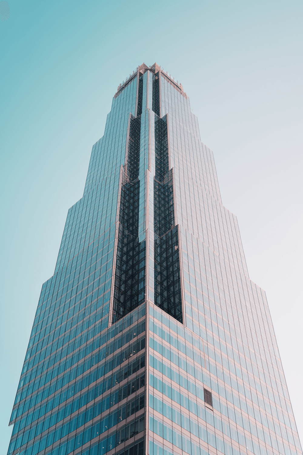 Close view of a glazed curtain wall with fine vertical mullions