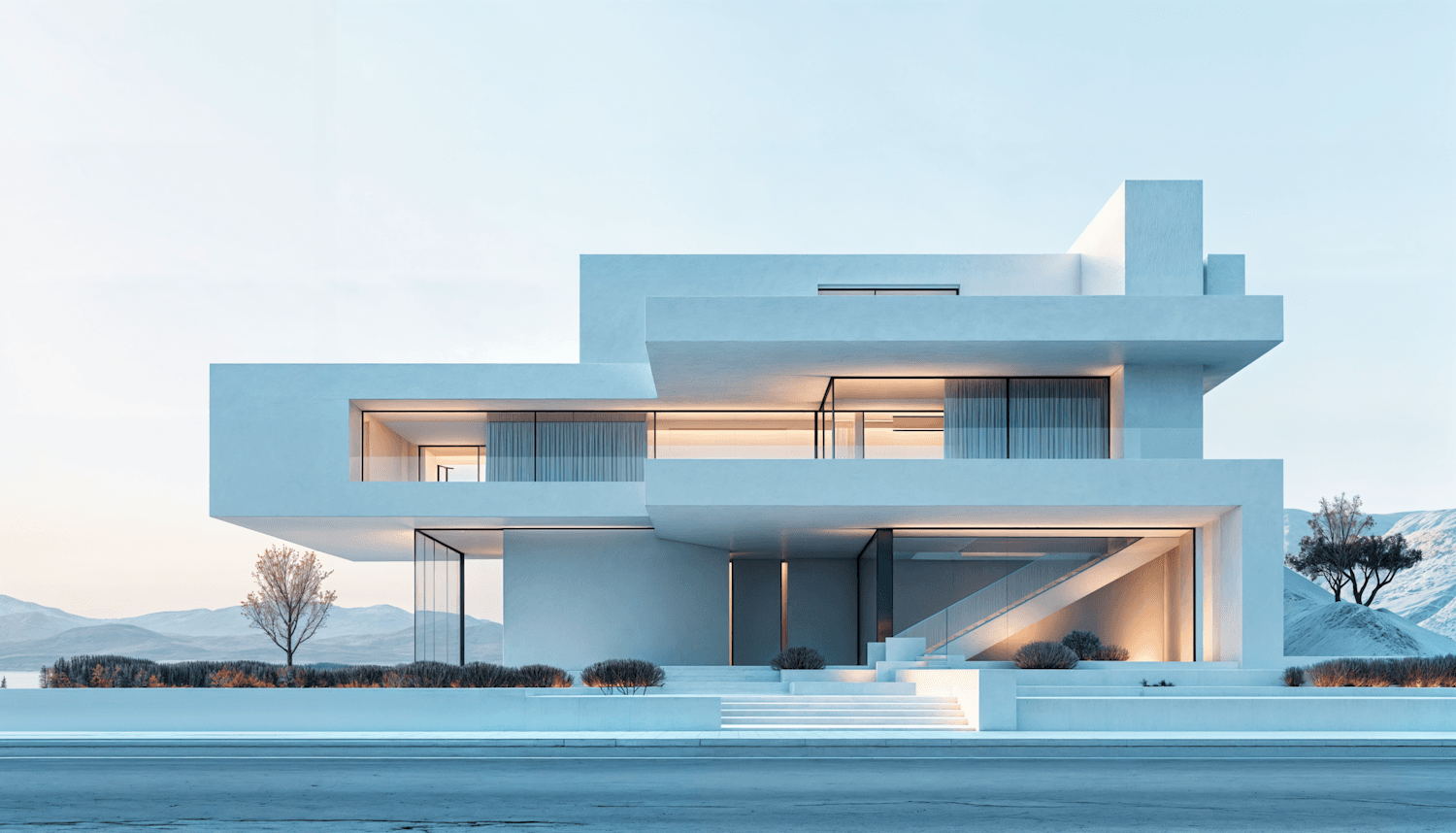 White stepped house at dusk with warm light behind its glazing